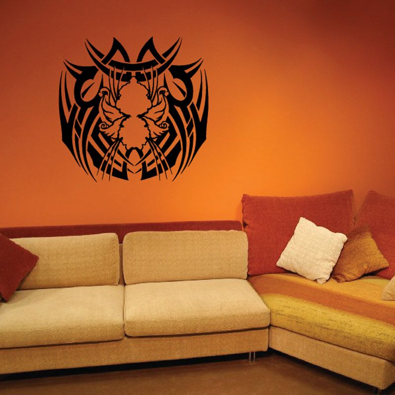 Tribal-style decorative wall decal with dark ornate emblem