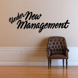 Under New Management wall decal in black cursive lettering