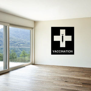Vinyl wall decal with black cross and syringe icon, with 'Vaccination' text