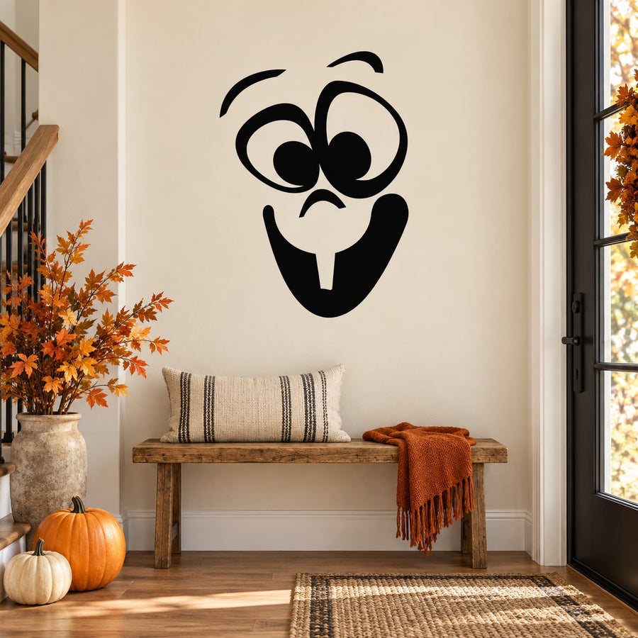 Black baby face decal with large eyes, circular cheeks, and stick tongue