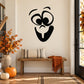 Black baby face decal with large eyes, circular cheeks, and stick tongue