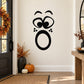 Black surprised face decal with wide eyes, open mouth, and small paw-print details