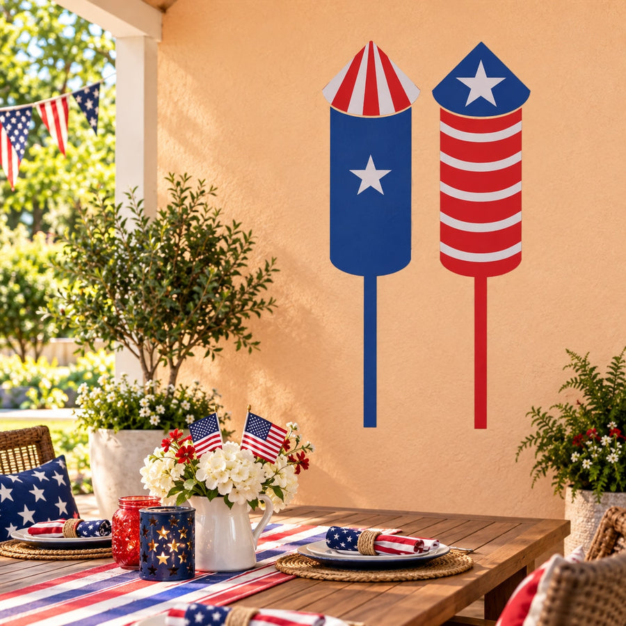 Stars and Stripes fireworks sticker with blue star rockets and red white stripes.