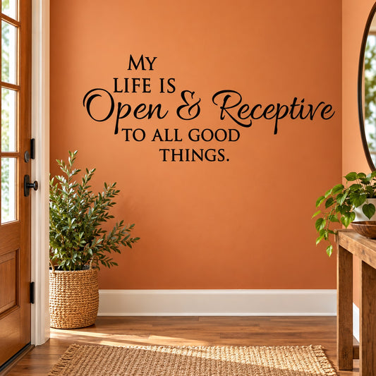 Black wall decal with quote: “My Life Is Open & Receptive To All Good Things.”