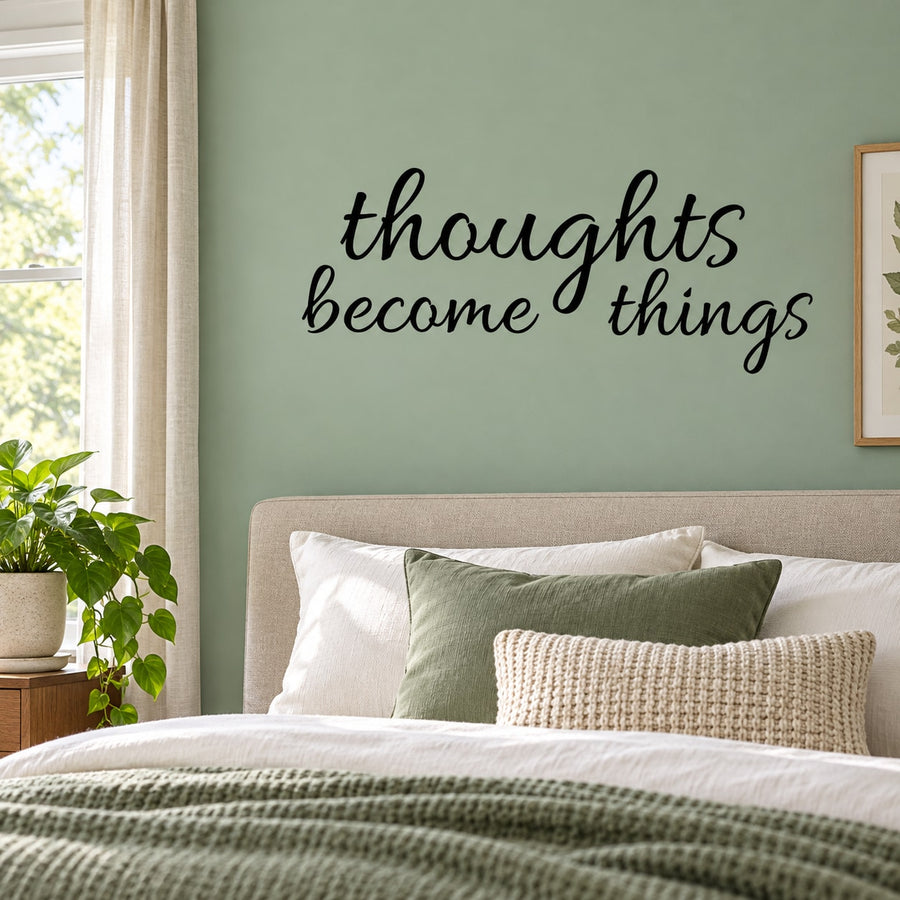Wall decal with cursive phrase 'thoughts become things'