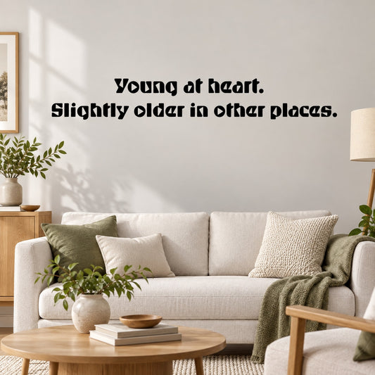 Wall decal quote: 'Young at heart' and 'Slightly older in other places'