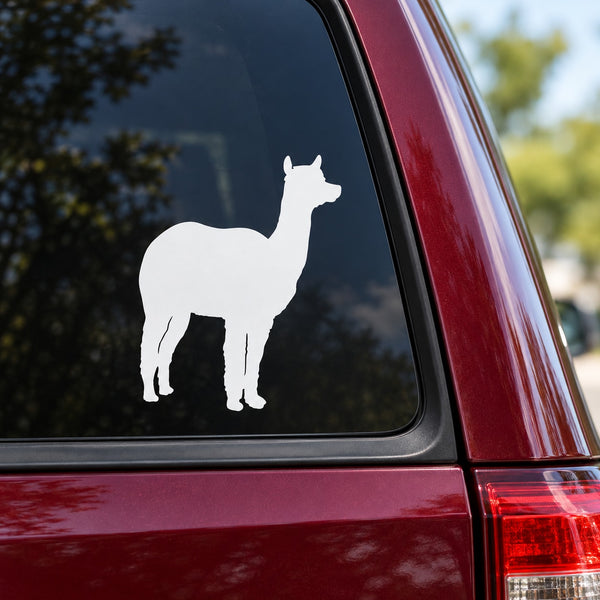 White alpaca silhouette decal on car window