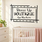 Black storefront-style wall decal with "Dress Up Boutique" sign and star border