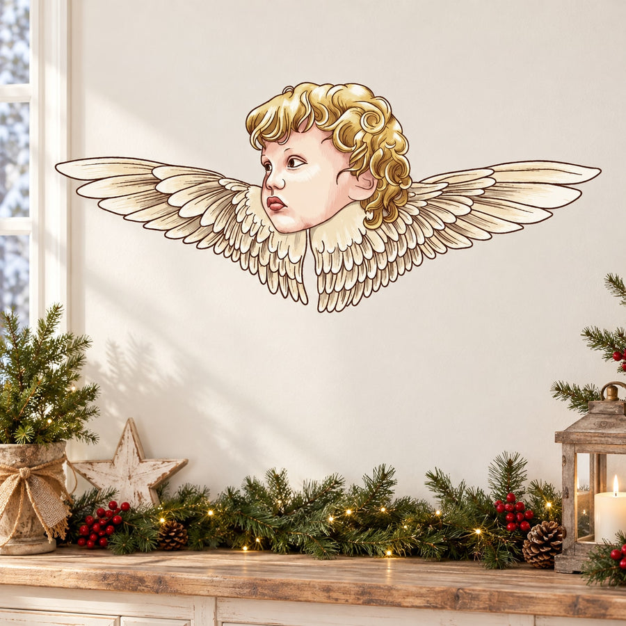Angel sticker: cherub face with blonde curls and spread wings in gold and cream.