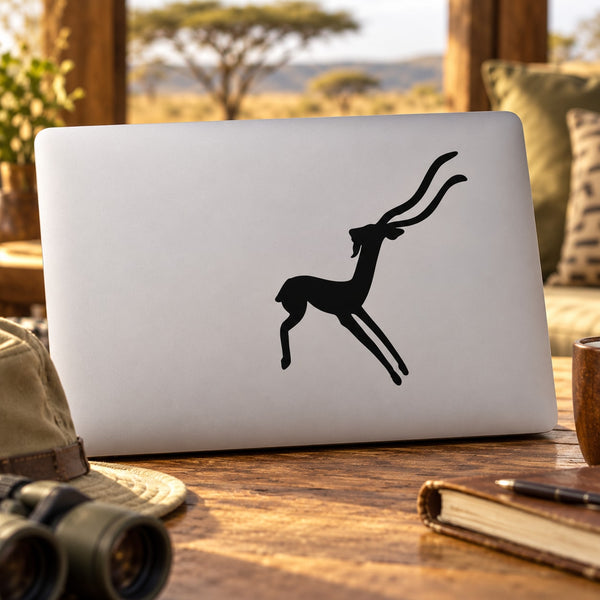 Abstract antelope silhouette decal on light laptop lid