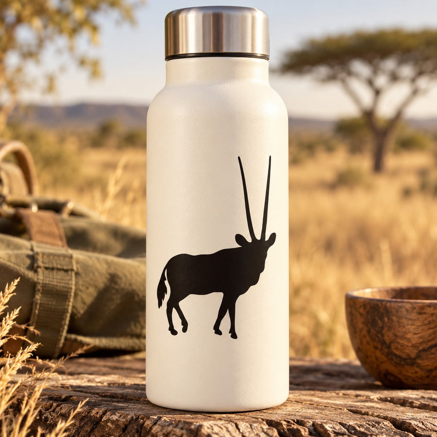 Cream bottle with standing antelope vinyl decal and brushed stainless cap