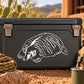 Sleepy Badger decal with white sleeping badger illustration on a dark rectangular surface
