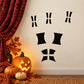 Halloween window vinyl decal with four arched pane shapes and black slits