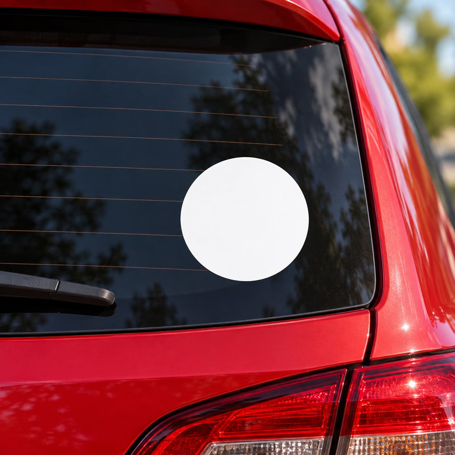 White circular moon decal on car window