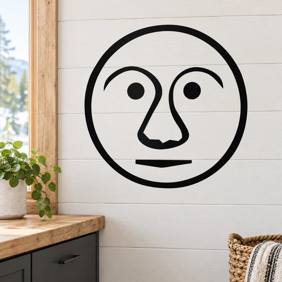 Black outline circular moon face decal with large nose and eyes
