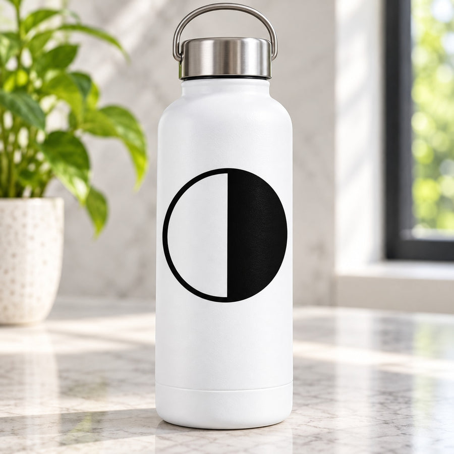 First quarter moon decal: black-and-white circular design split half and half