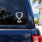 White trophy icon decal on dark vehicle window