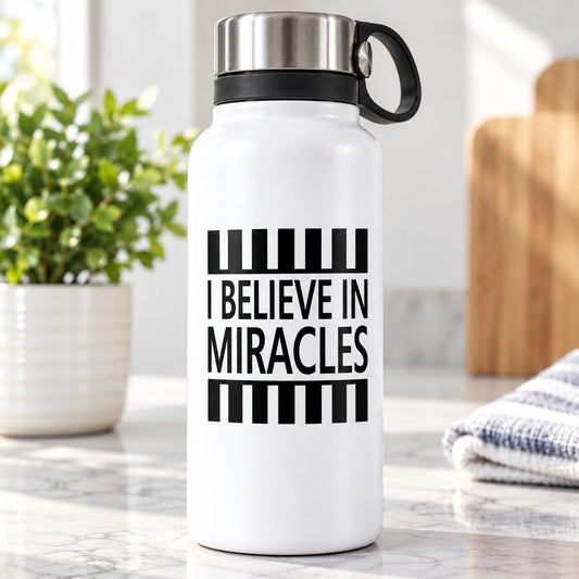 White bottle with black striped decal reading 'I Believe in Miracles'