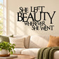 Inspirational wall decal with bold black text: She left beauty wherever she went