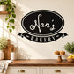 Black oval Nan's Bakery wall decal with white script and ribbon banner