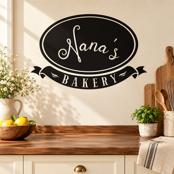 Bakery wall decal with oval Nana’s Bakery lettering in black and white