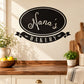 Bakery wall decal with oval Nana’s Bakery lettering in black and white