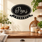 Pop's Bakery oval wall decal with "Pops" and "Bakery" in white on black