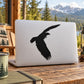 Black bald eagle flapping decal sticker, spread-wing silhouette on white surface