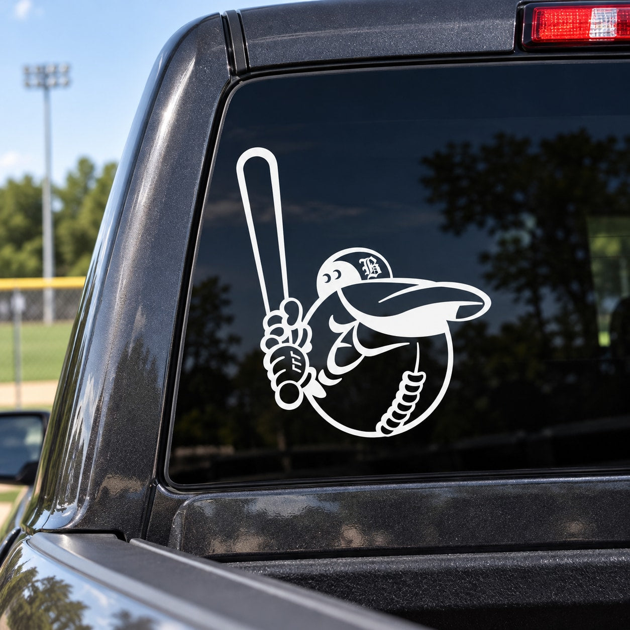 Baseball mascot decal on car window, black and white outline