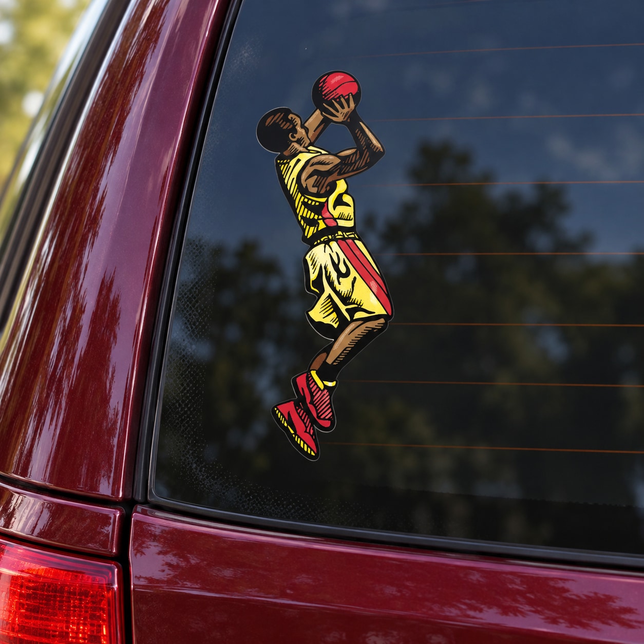 Basketball player vinyl decal sticker in black and yellow uniform, die-cut
