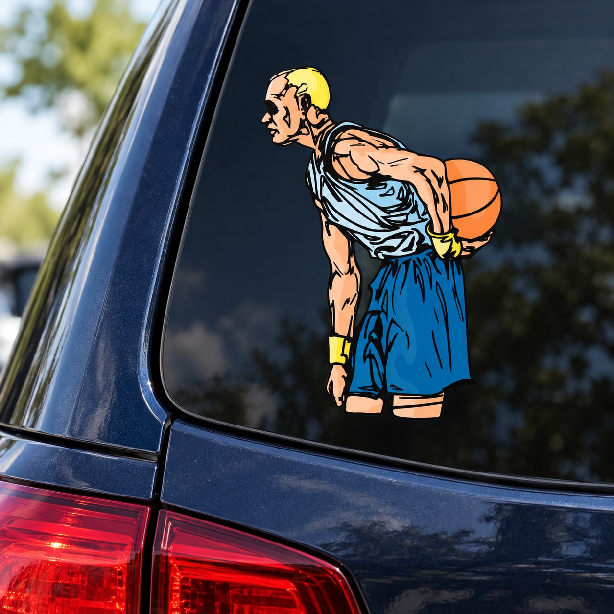 Die-cut vinyl decal of cartoon basketball player holding an orange ball