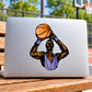 Die-cut basketball vinyl sticker showing a player with a black dog face holding a ball
