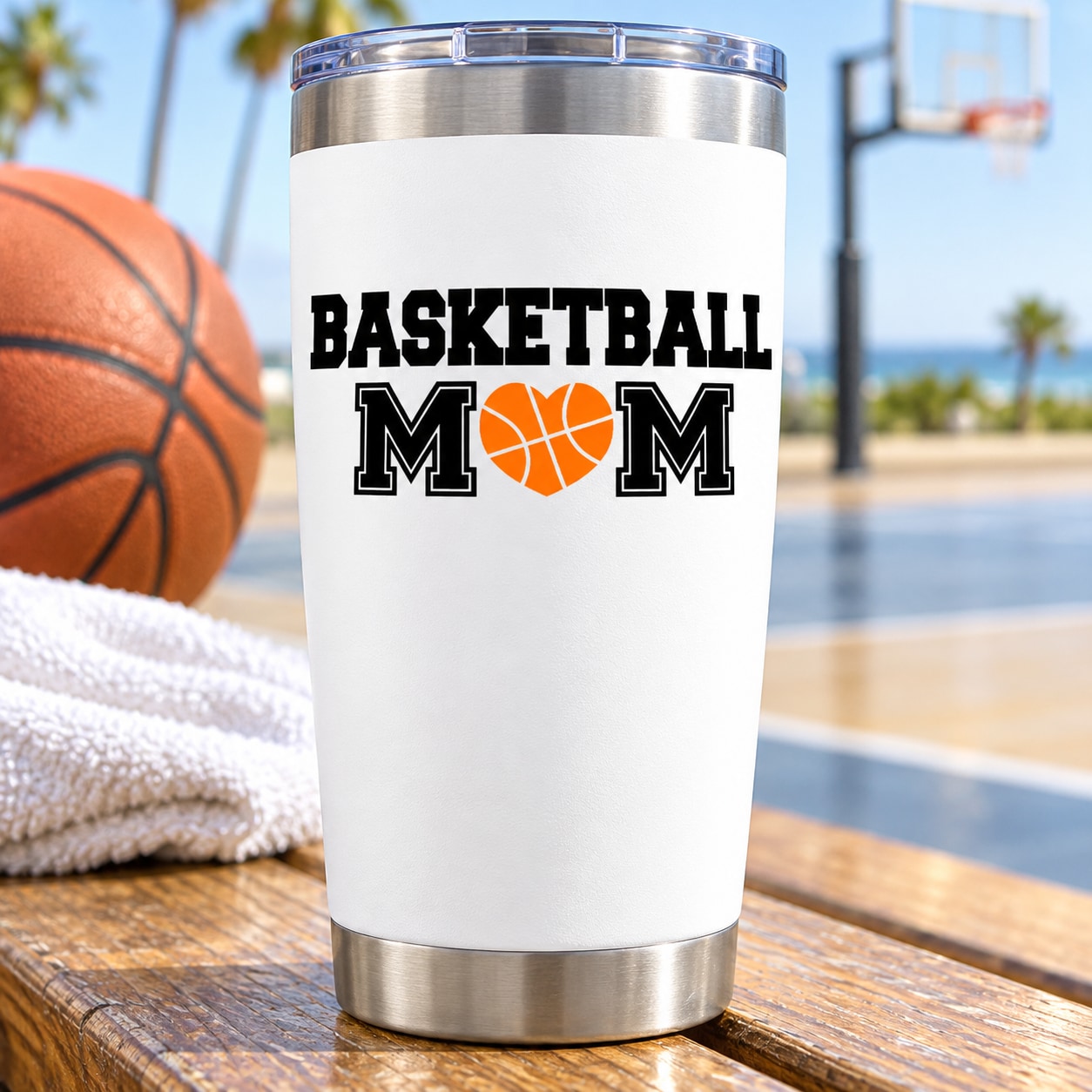 White stainless steel tumbler with Basketball Mom heart decal and basketball graphic.
