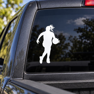Female basketball player decal with white dribbling silhouette on vehicle window