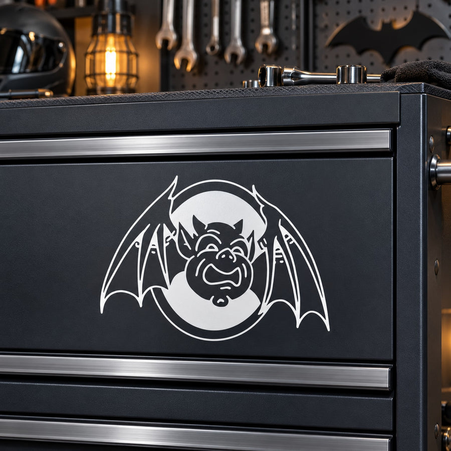 Framed bat decal with white bat graphic on dark panel