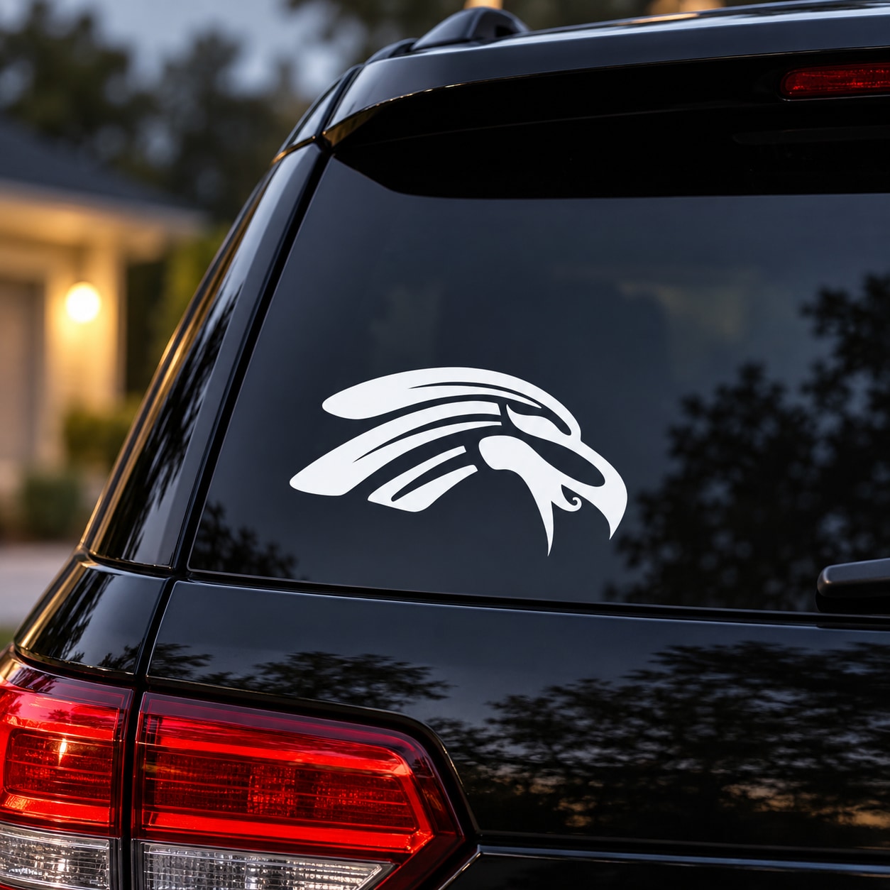 Tribal eagle head vinyl decal, white design on car rear window
