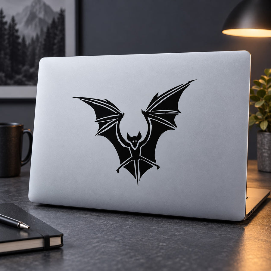 Black bat decal with wings spread, centered on light surface