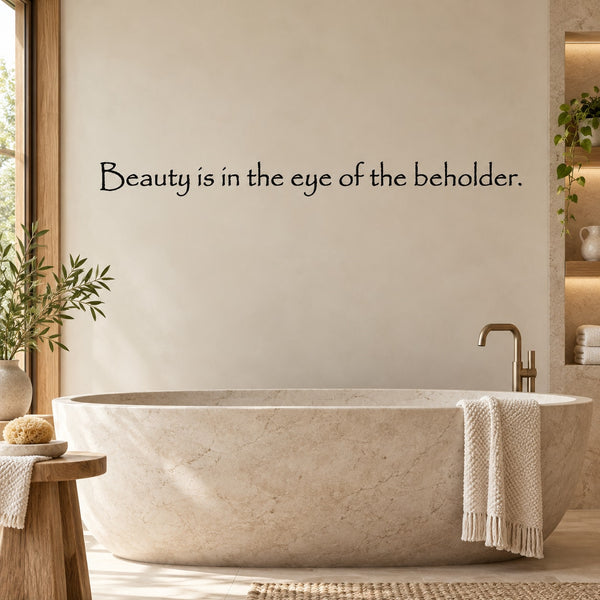 Wall quote decal: 'Beauty is in the eye of the beholder.' dark script text
