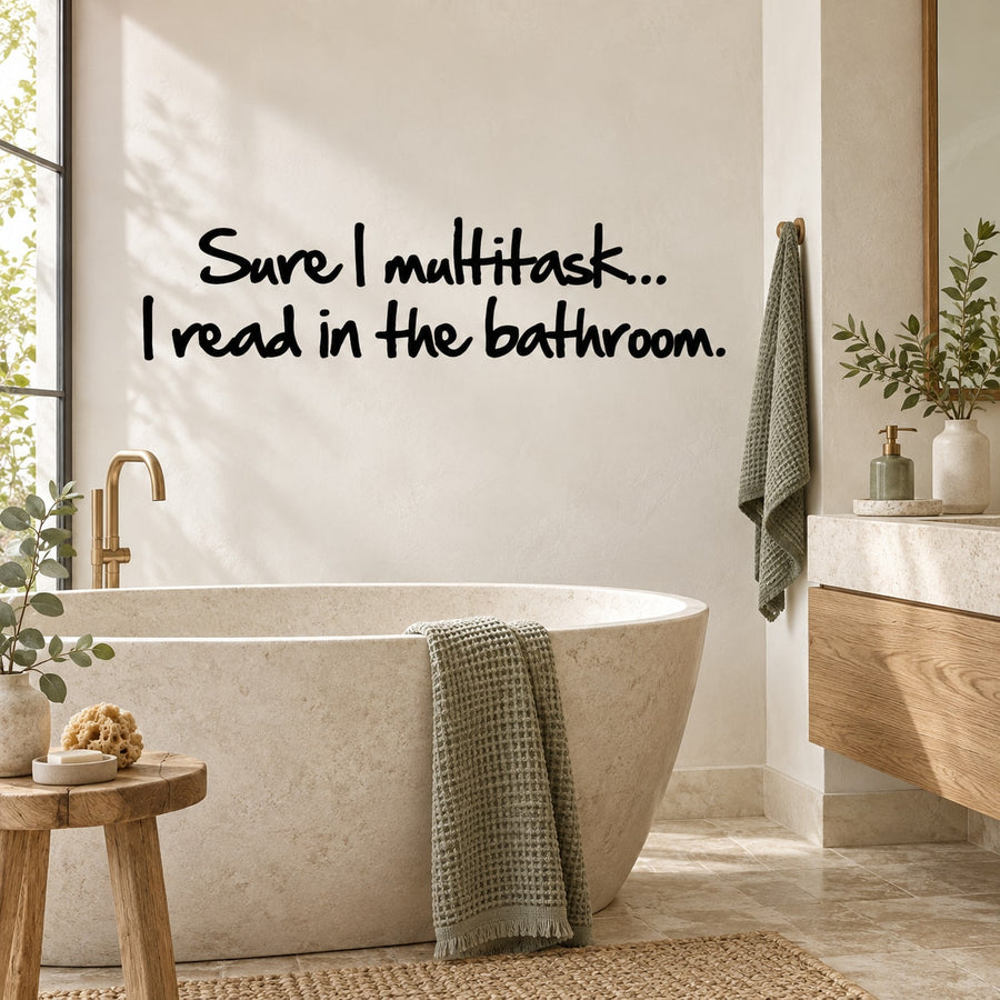 Bathroom wall decal with black quote lettering: “Sure I multitask… I read in the bathroom.”