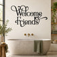 Black ornate script wall quote reading 'Welcome Friends'