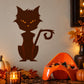 Brown cat vinyl wall decal with orange eyes and curled tail design