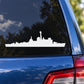 White destroyer ship silhouette decal on blue car panel near rear taillight