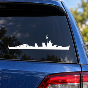 White destroyer ship decal silhouette on dark vehicle window