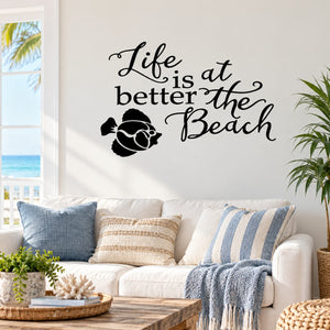 Beach wall decal with black cursive text and surfboard-and-fish graphic