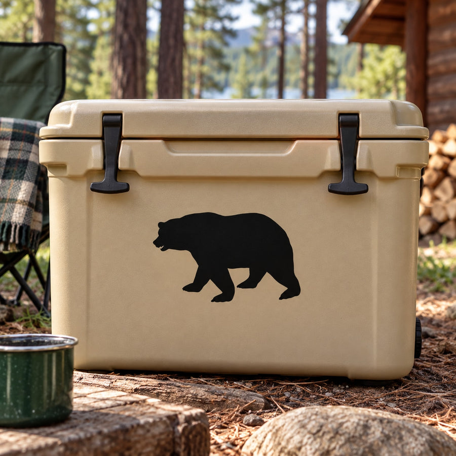 Black bear silhouette decal on light tan cooler lid