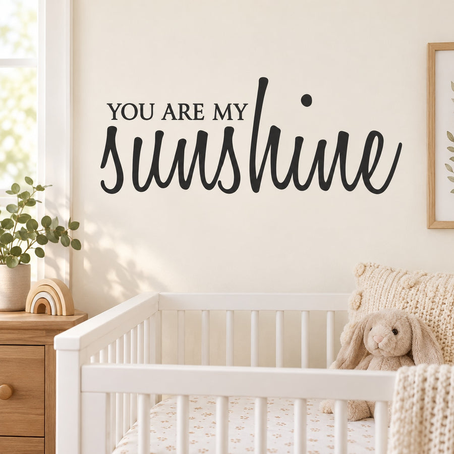 Black wall decal with 'You are my Sunshine' script lettering.