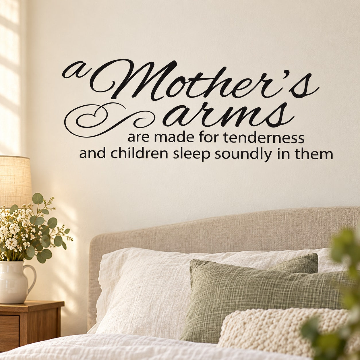 Wall decal: cursive "Mother's Arms" quote about tenderness and children sleeping.