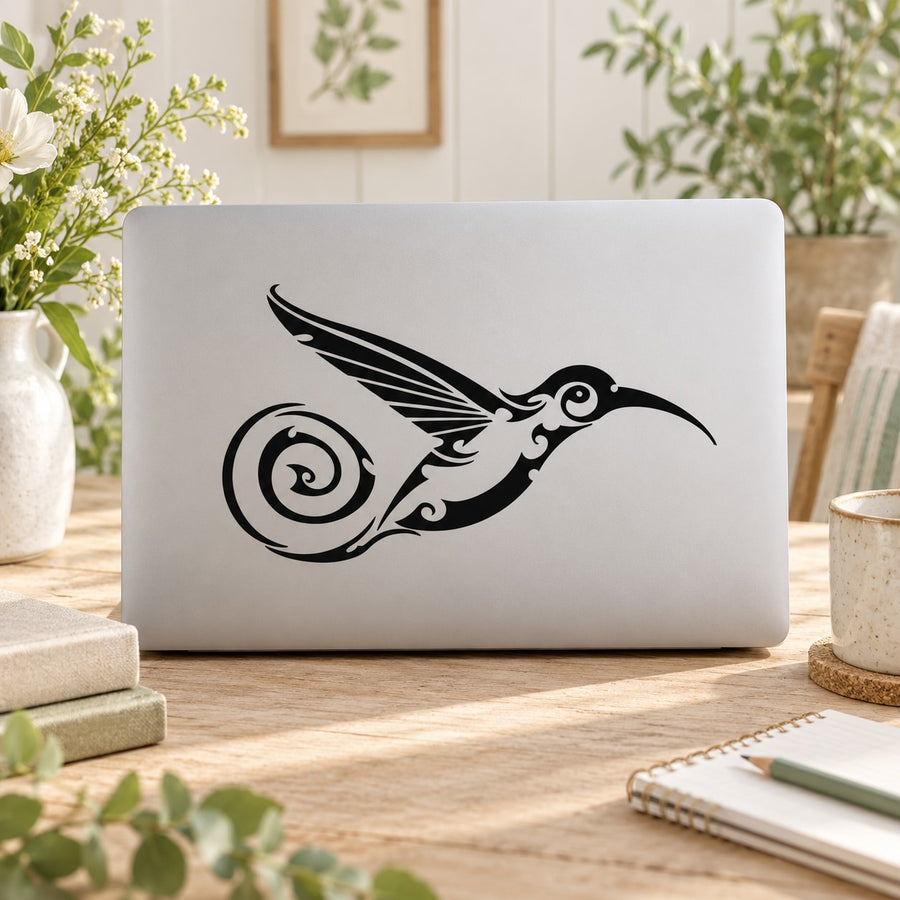 Curly hummingbird tail decal, black swirl design on white surface