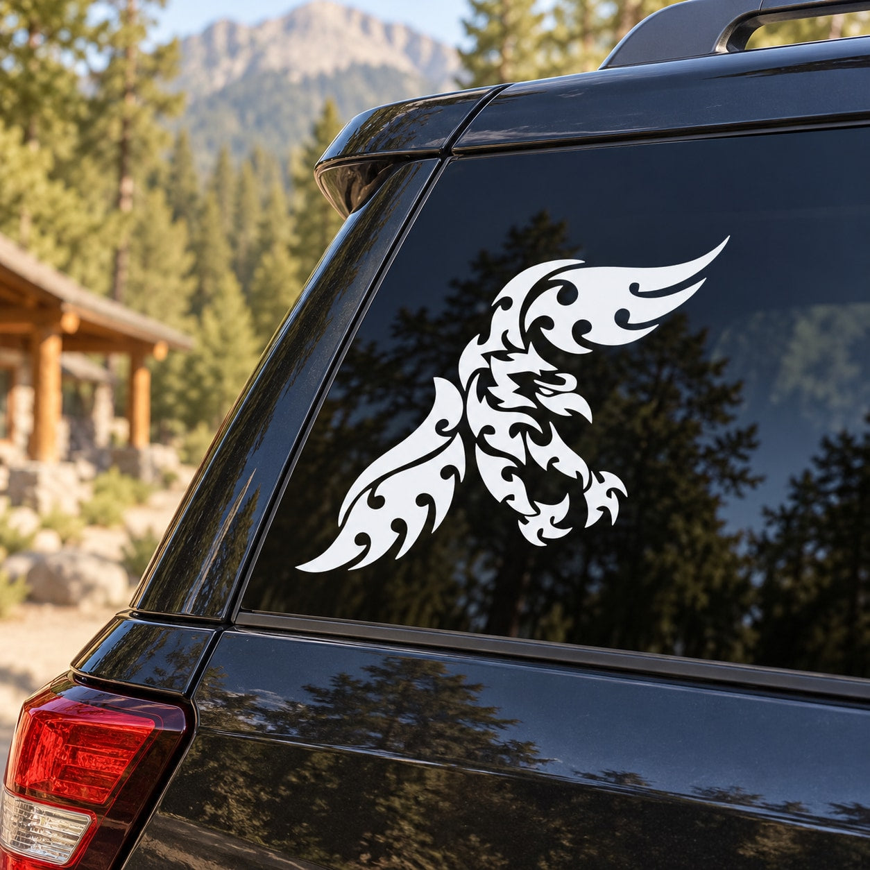 Eagle decal sticker with white tribal flames on dark car rear panel