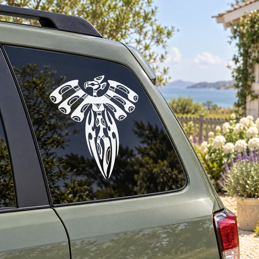Aztec bird decal, white stylized bird graphic on dark car window